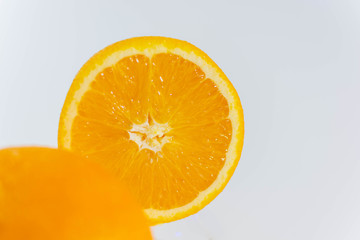 Orange and orange slice on a white background