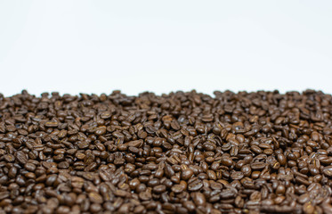 Coffee beans scattered on a white background horizontal photo