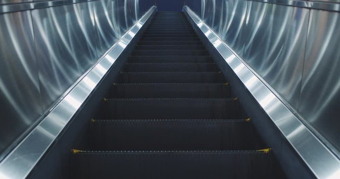 Futuristic escalator at night in Shinjuku Tokyo with no people 4K DCI