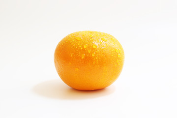 Orange with water drop on white background