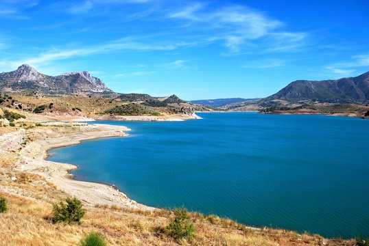 View across the reservoir towards the mountains (Embalse de Zahara), Zahara de la Sierra, Spain.