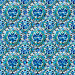 Seamless background from a set of decorative ceramic dishes hand-painted with acrylic paints with a floral pattern