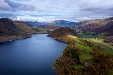 Fototapeta na wymiar Stunning aerial drone landscape image of glorious vibrant Autumn Fall sun over Thirlmere in Lake District