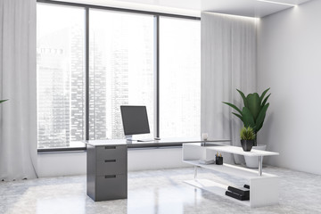 White home office interior with computer