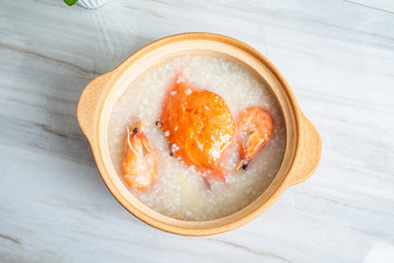 Chinese Chaoshan casserole porridge, a pot of shrimp and crab seafood porridge on the kitchen countertop