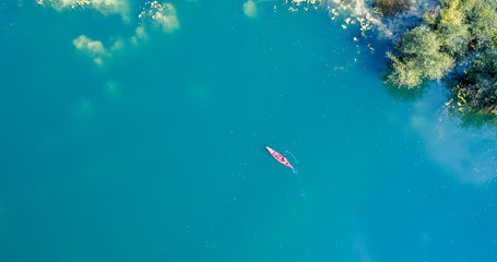 Aerial view of red canoe on the Mreznica River, Croatia
