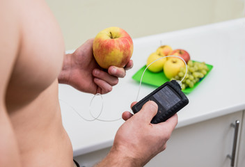 Diabetic man with an insulin pump connected in his abdomen. 