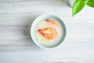 Chinese food seafood porridge, a bowl of shrimp porridge on the kitchen countertop