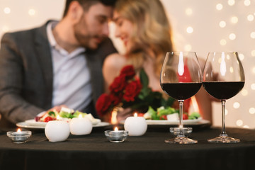 Romantic Couple Blurred In Background Celebrating Valentine's Day In Restaurant