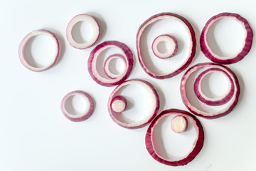 Sliced red onion rings isolated on white background cutout view