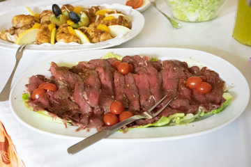 A plate of delicious roast beef carpaccio