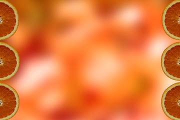 Orange blurred background with orange slices