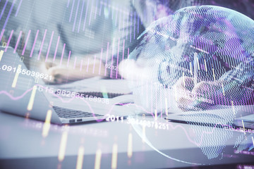 Multi exposure of forex chart with man working on computer on background. Concept of market analysis.