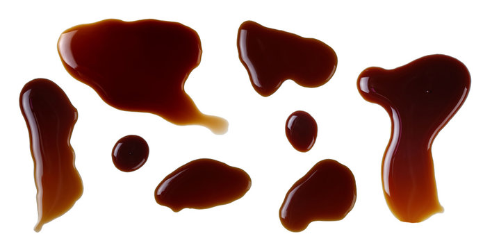 Soy sauce splashes isolated on white background.