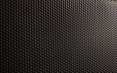Metal perforated bronze background..