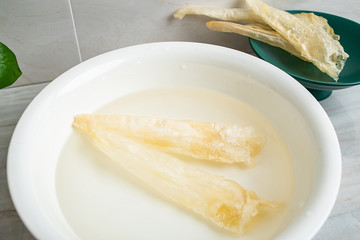 Fototapeta na wymiar Traditional health and nourishing food Maw, catfish glue soaked in water