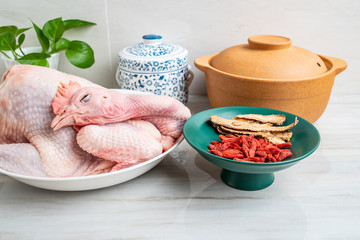 Chinese nutritious health soup ingredients, fresh hen and wolfberry angelica flakes