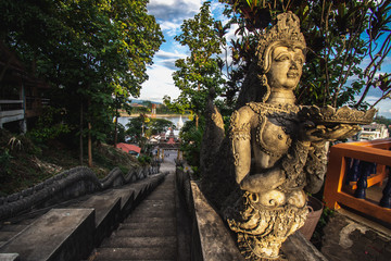Fototapeta na wymiar Wat Phra That Phu Khao, located on a mountain in Chiang Saen, Chiang Rai Province, Thailand