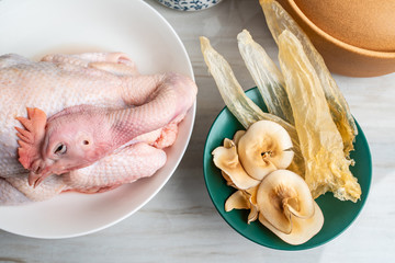 Ingredients of Chinese tonic health soup, fresh hen and snail shell
