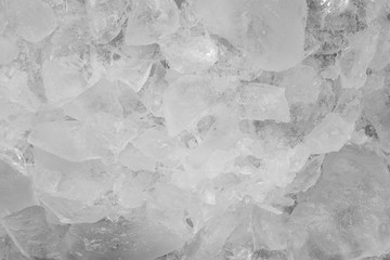 Pieces of crushed white ice glass cracks background texture. close-up frozen water