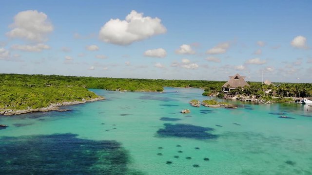 Skyline drone footage of island snorkeling lake and forest