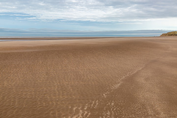 Fototapeta na wymiar The vast sandy beach at Formby in Merseyside, at low tide