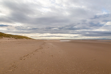 The vast sandy beach at Formby in Merseyside, at low tide - Powered by Adobe
