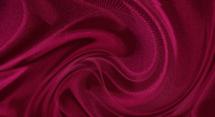abstract fabric background. waves folds of fabric dark red color