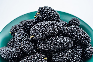 Fresh ripe black mulberry closeup