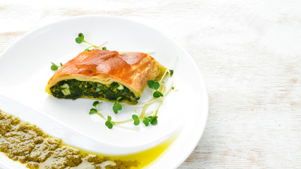 Baked rolls with spinach and cheese. Top view. Free space for your text.