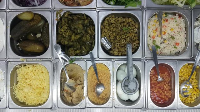 Top Down Slider Shot Bowls of Fresh Ingredients in Mezze Gyro Eatery
