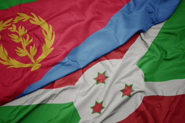 waving colorful flag of burundi and national flag of eritrea.