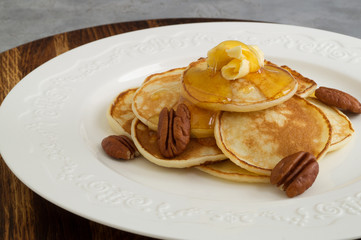 Pancakes with butter and honey.