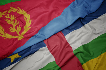 waving colorful flag of central african republic and national flag of eritrea.