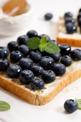 Fototapeta premium blueberry toast with cream cheese and honey