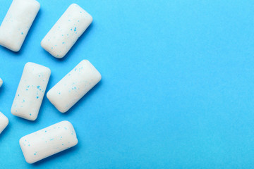 Chewing gums on color background