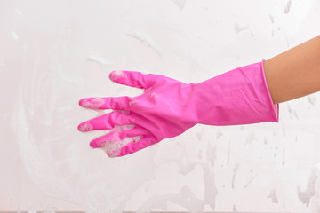 Woman cleaning window at home