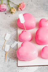 Pink Mousse dessert in the shape of  hearts. Mousse cake for Valentine Day