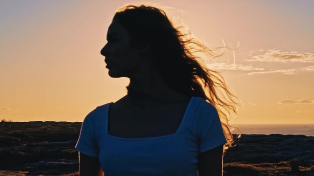 Laperouse, Australia - Beautiful Young Woman With A Blonde Hair Enjoy Looking On The Beautiful Sunset and Green Hills - Wide Shot