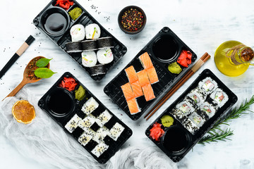 Set sushi and rolls. Asian food delivery. Soy sauce, wasabi. Top view. free space for your text.