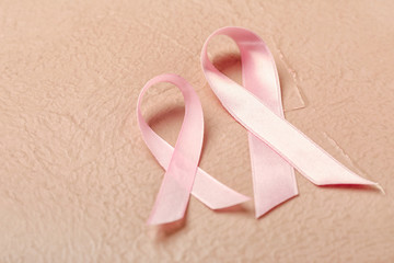 Pink ribbons on color background. Breast cancer awareness concept