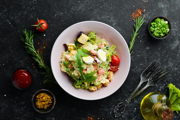 Caesar salad with chicken. Vegetable salad. Top view. Free space for your text.