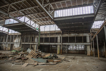 Fototapeta na wymiar Interior of an abandoned industrial workshop. MIG Aircraft Building Plant in Moscow, Russia