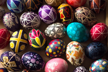 Background with Easter hand-painted eggs in a folk style. Easter holiday.