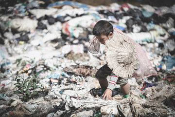  Children find junk for sale and recycle them in landfills, the lives and lifestyles of the poor, Child labor, Poverty and Environment Concepts