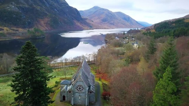 Flying over a church on a loch in Scotland