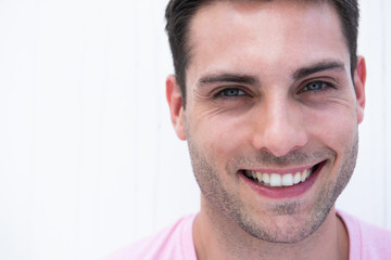 Close up face portrait of smiling young man