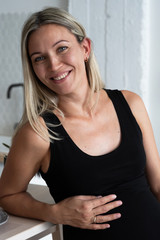 Portrait of a gorgeous blonde in a black dress