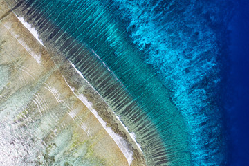 View on the coral reef. Azure water background from top view. Summer seascape from air. Travel -...
