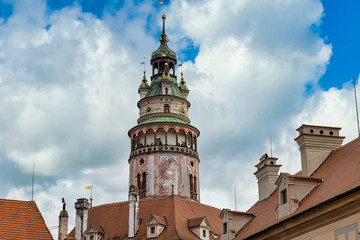 Fototapeta na wymiar Cesky Krumlov castle tower view and cloudy sky, famous touristic destination in Czech Republic